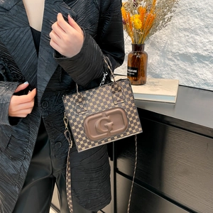 Vintage dark brown crossbody bag with embossed G logo and monogram pattern