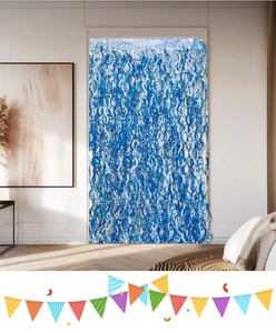 Detail of blue foil fringe curtain with metallic finish and colorful party buntings