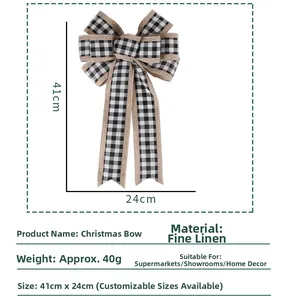 Detailed view of large black and white buffalo plaid Christmas bow in fine linen material
