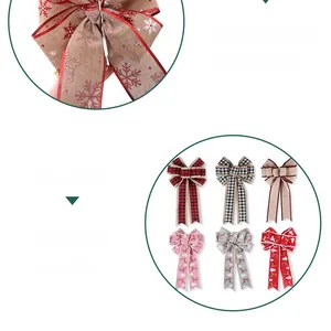 Detail of six Christmas burlap bows with red and grey snowflake patterns for decor