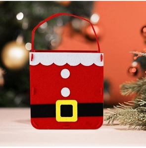 Detail of red felt Christmas gift bag featuring a Santa Claus costume design