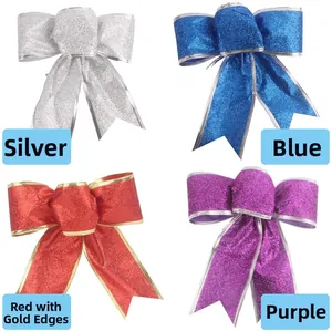 Close-up of four festive glitter bows in silver, blue, gold-red, and purple for decoration