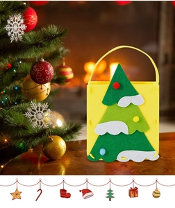 Detail of Christmas felt gift bag featuring a 3D collage Christmas tree on yellow fabric