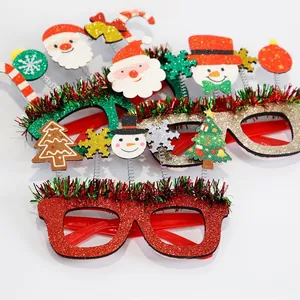 Detail of Christmas party glasses featuring Santa, snowman, and glittery festive decor