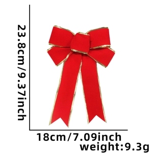 Detail of red velvet Christmas bow with gold trim showing 23.8x18 cm dimensions
