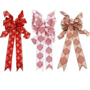 Set of three large Christmas bows with red prints and snowflakes for tree decoration