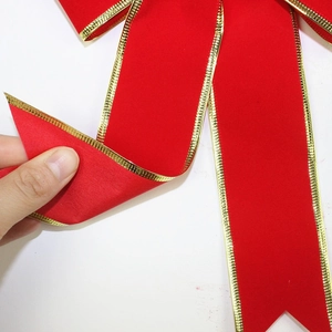 Large 25cm red velvet Christmas bow with gold trim for festive holiday tree decoration