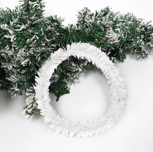 Detailed view of white artificial leaf wreath for Christmas and wedding decor