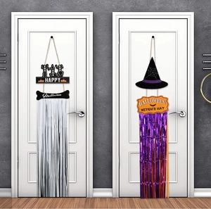 Halloween door hangers with skull and witch hat designs featuring sparkly tinsel tassels