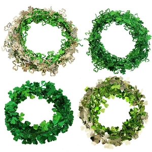 Four styles of St. Patrick's Day shamrock tinsel garlands in green and gold metallic finishes