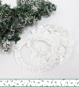 Detail of two white heart-leaf decorative wreaths for Christmas and winter party decor