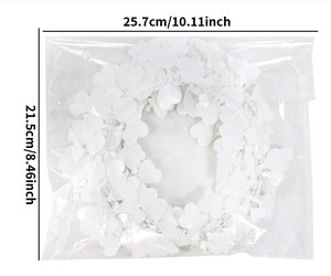Close-up of a white heart-shaped garland wreath measuring 25.7cm for festive decor