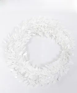 Detail of white artificial heart-shaped garland with layered faux leaves for Christmas decor