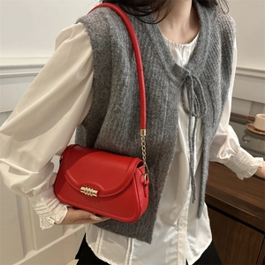 Fashionable red leather shoulder bag with gold metal clasp and chain strap for women