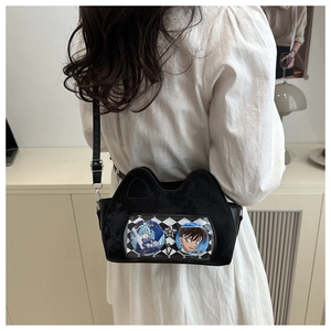 Detailed view of the black velvet cat-eared itabag with a transparent display window