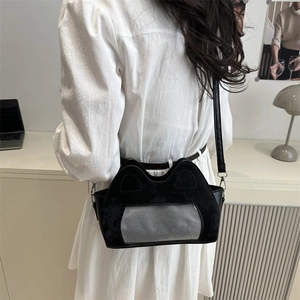 Cute black cat-ear shoulder bag with a mesh pocket, shown being worn by a model