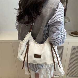 Chic cream white wrinkled leather tote bag with vintage brown accents for women