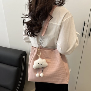 Pink corduroy tote bag with chain strap and cloud charm for casual commuting