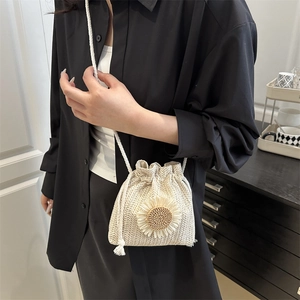 Chic woven bucket bag with sunflower detail and drawstring closure for spring vacation