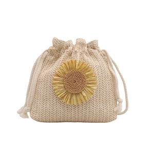Beige straw bucket bag with sunflower detail and white drawstring closure for women