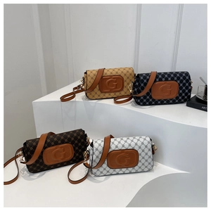 Detailed view of four textured crossbody bags with G-logo in brown, blue, coffee and white