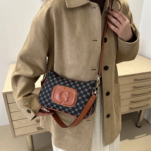 Chic grey monogram shoulder bag with leather trim and decorative G logo for women