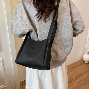 Chic black litchi pattern leather bucket bag with fashion embossing for women's daily use