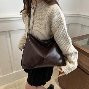 Minimalist glossy dark brown tote bag in vintage style for women's daily commute