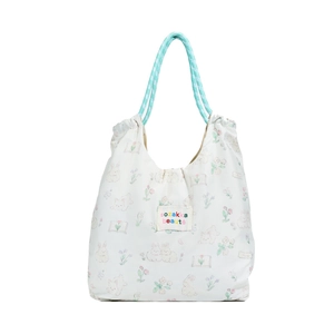 Minimalist white tote bag with cute rabbit illustrations and green woven rope handles