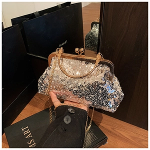 Silver sequin shell evening bag with golden chain and bead clasp closure detail