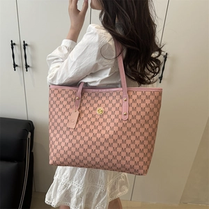 Pink tote bag with all-over M monogram print and gold logo on minimalist background