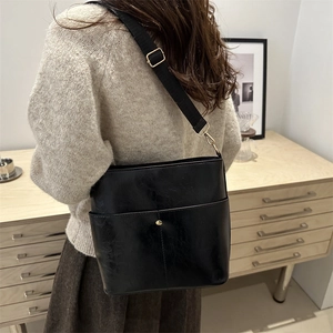 Retro black PU leather bucket shoulder bag for women with gold button and nylon strap