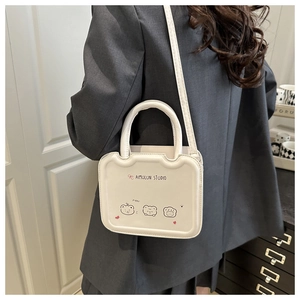 Rear view of model wearing a white PU leather square handbag with cute bear illustrations