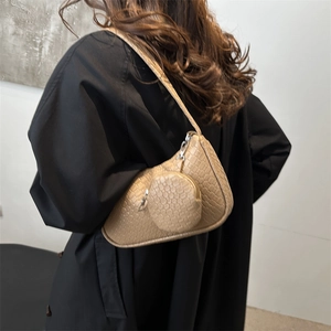 Khaki embossed shoulder bag with matching round pouch and geometric textured finish