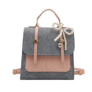 Mini sac à dos vintage pour femme en couleurs contrastées avec breloque nœud et perles