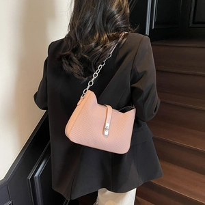Pink textured leather shoulder bag with cat-ear design and silver chain strap