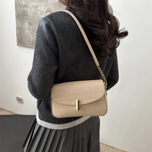 Chic beige crocodile embossed crossbody bag for women with gold clasp and chain strap