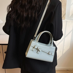 Mint green square shoulder bag with metal buckle bow and leather top handle