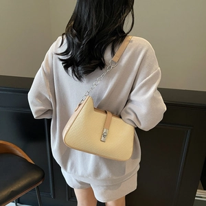 Beige woven kitten-ear shoulder bag with silver metallic twist lock and chain strap