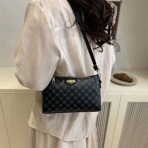 Chic black crossbody bag with geometric patterns and FASHION label for daily wear