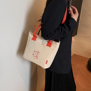 Women's canvas bucket bag with contrast red straps and cute cartoon bear print