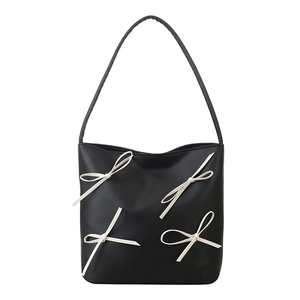 Minimalist black PU leather crossbody bucket bag with four 3D cream ribbon bows