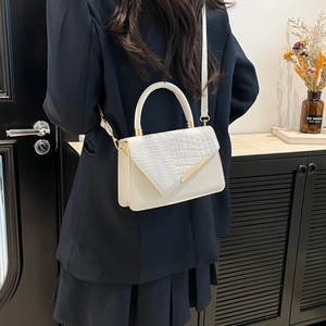 Chic white square crossbody bag with crocodile embossed flap and gold metal trim detail