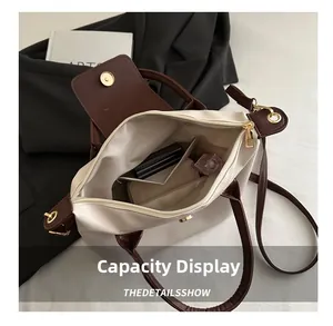Top view of spacious interior storage with zip closure and pockets in cream tote bag