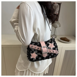 Close-up of Y2K tweed crossbody bag with pink star charms and metal buckle detail