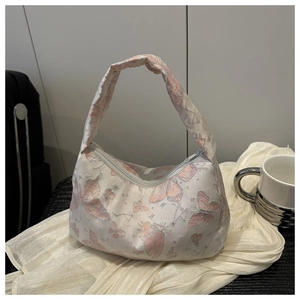 Detail of hobo bag with pink butterfly jacquard fabric and silver thread embroidery