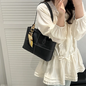 Chic black tote bag with snake print panels and printed scarf for 2025 casual style