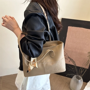 Minimalist beige tote bag with crocodile texture and silk scarf handle for women