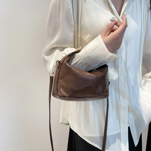 Retro dark brown leather pillow handbag with gold buckle and adjustable strap