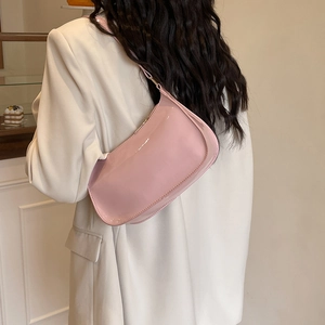 Pink patent leather underarm bag for women with glossy finish and adjustable strap